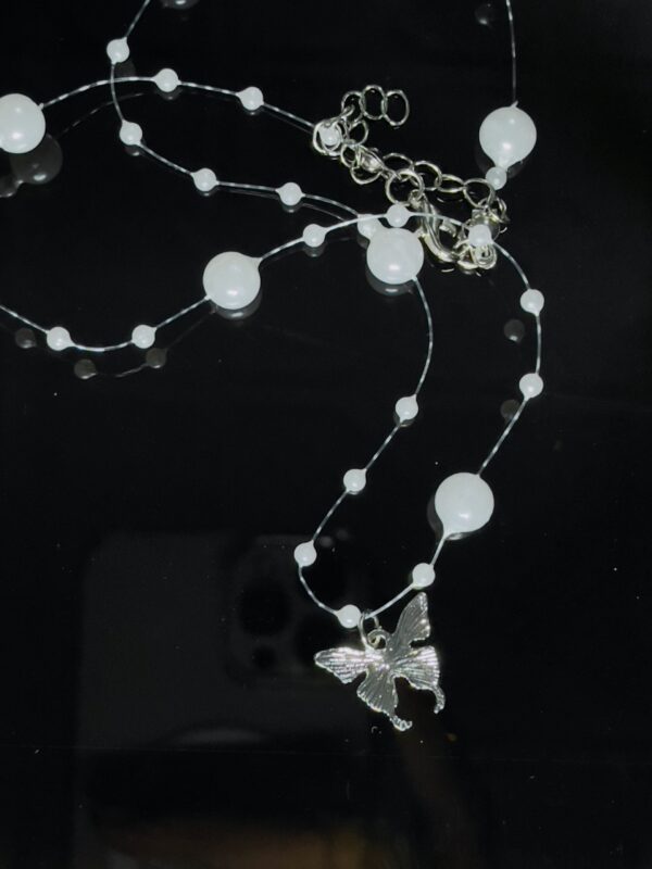 Butterfly entangled in pearl Chain - Image 2